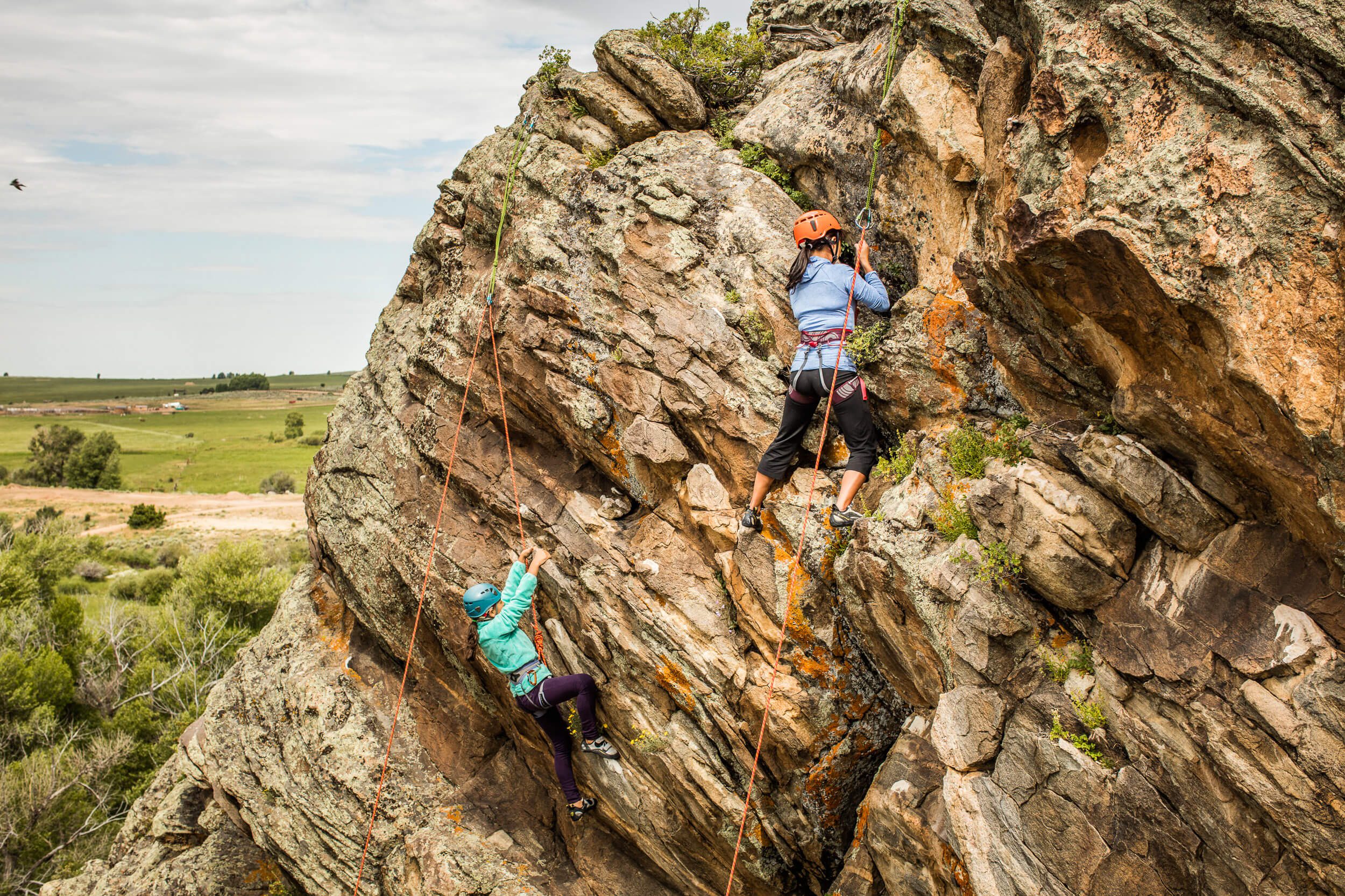 Women rock climbing