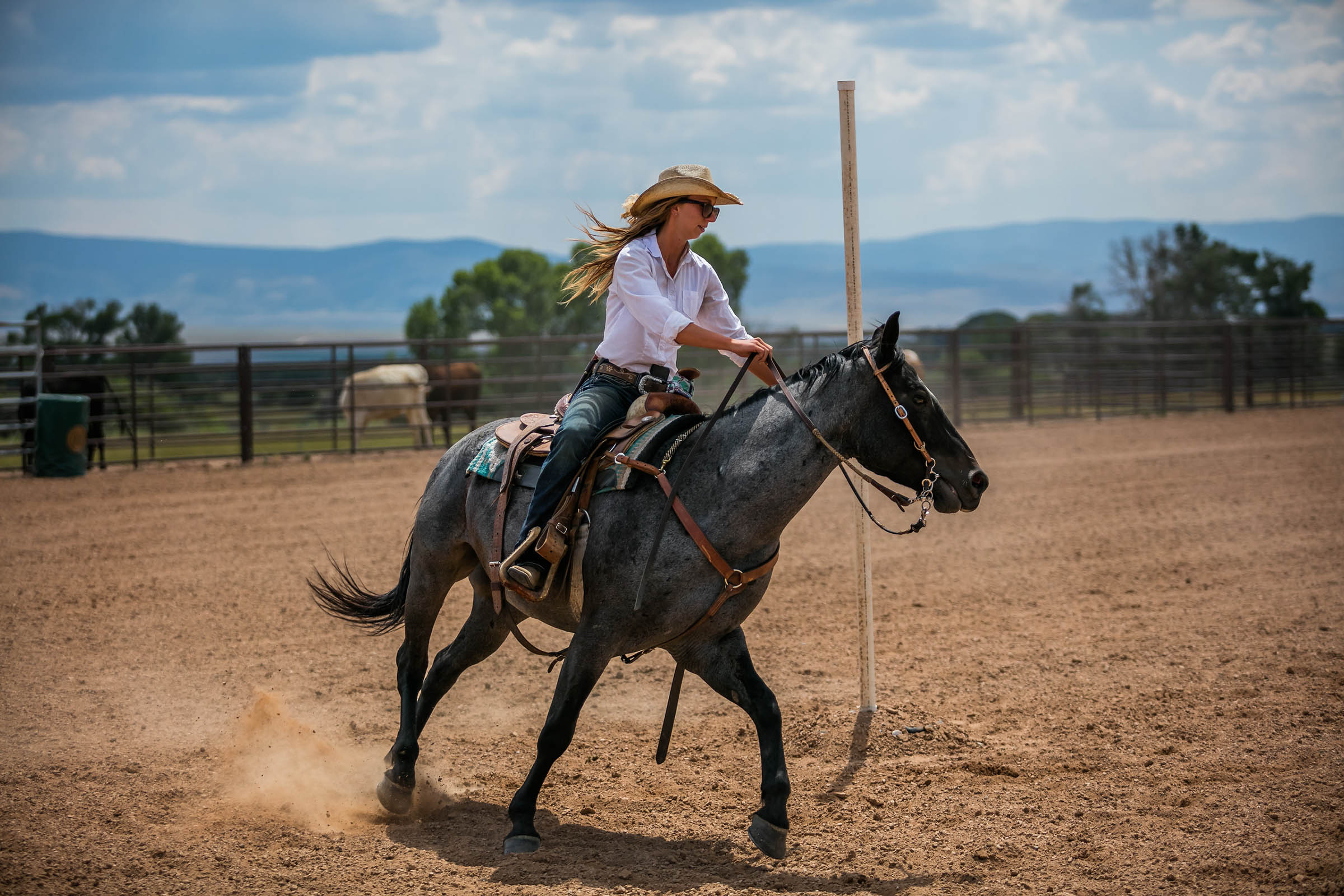 Woman pole bending with horse